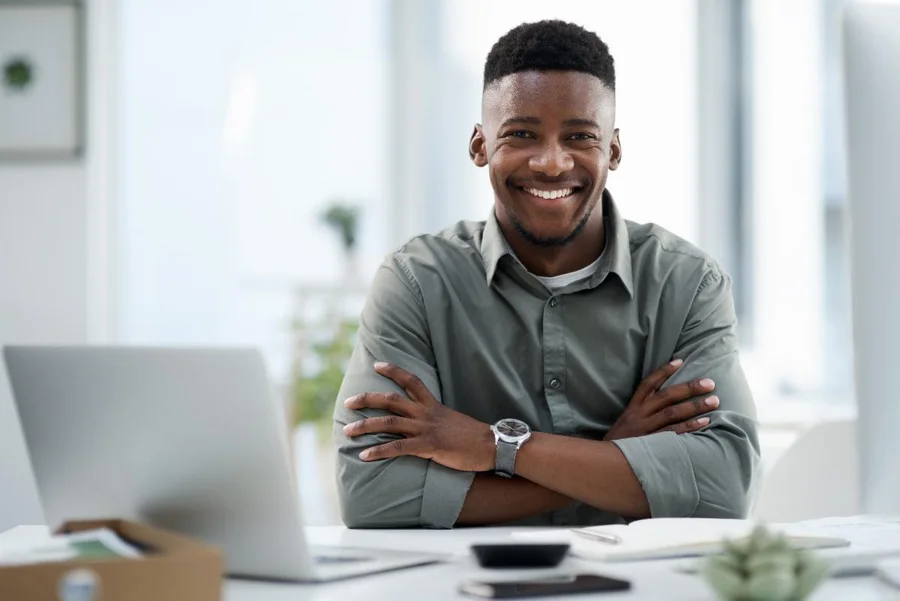 Smiling professional sitting at a desk
